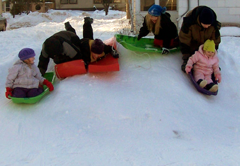 the kids sledding down