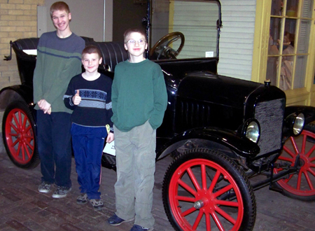 The boys in front of an old Model T