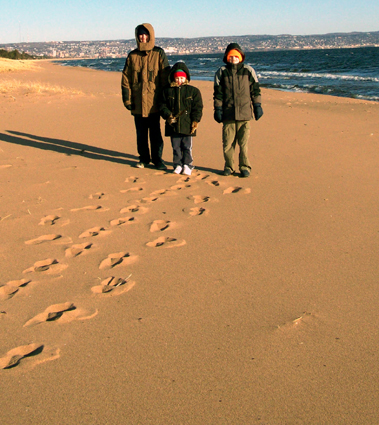 Alex, Nora, and Caleb on the beach
