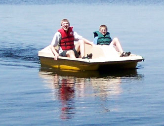 Alex and Caleb on the paddle boat