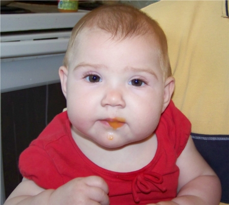 Ella eating baby food