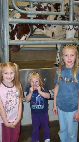 the girls with Clarabel the cow