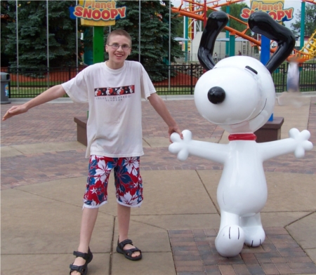 Caleb with a Snoopy statue