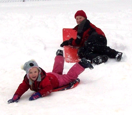 Anna and Corbin sledding