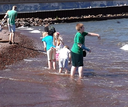 the kids wading and rock hunting