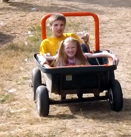 Caleb and Rosa in a wagon