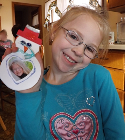 Anna with a snowman magnet