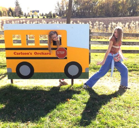 Nora and Rosa hamming it up with a bus cut out