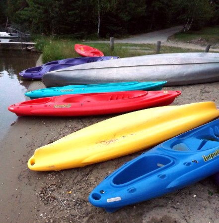 colorful kayaks in a row