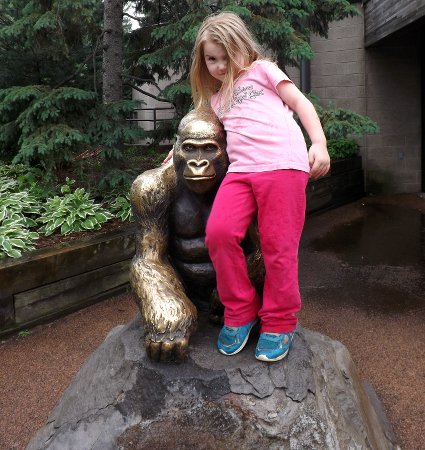 Ella on a gorilla statue