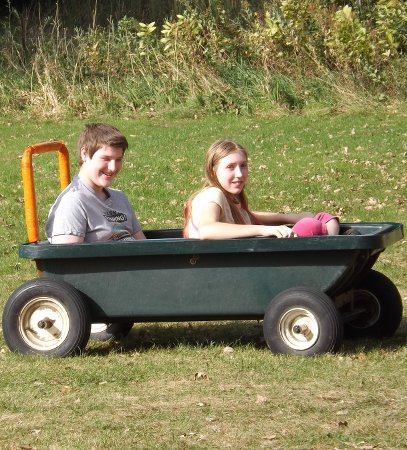 Nora and Corbin in a wagon