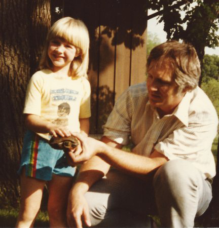 My dad and I with a crayoned turtle