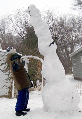 Alex and the snowman leaning over him