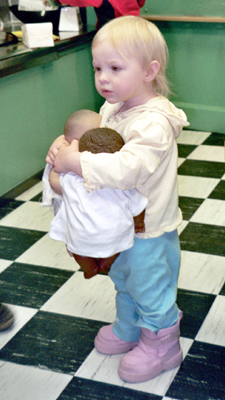 Anna holding two babies