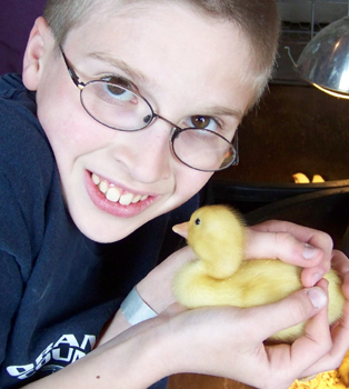 Caleb holding a duck