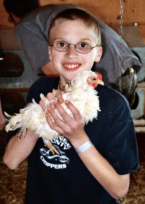Caleb holding a chicken