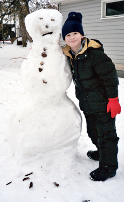 Corbin and a snowman his size