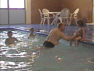the kids and Lee in the pool