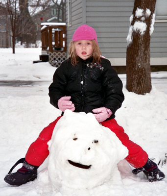 Nora riding her snow cat