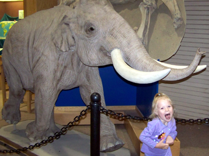Anna and a dwarf elephant replica