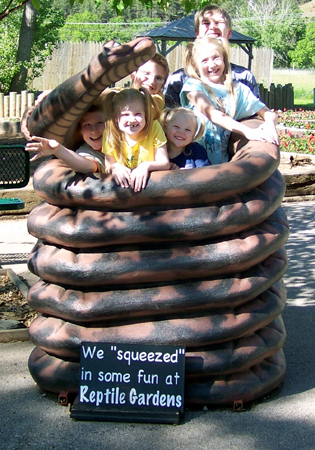 the kids in a fake giant snake