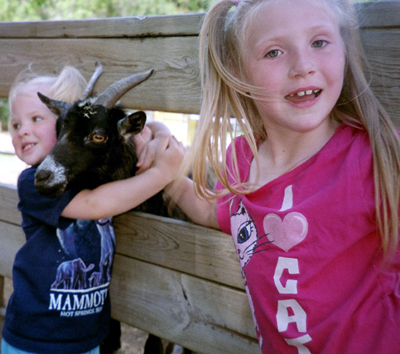 Anna and Nora with a goat
